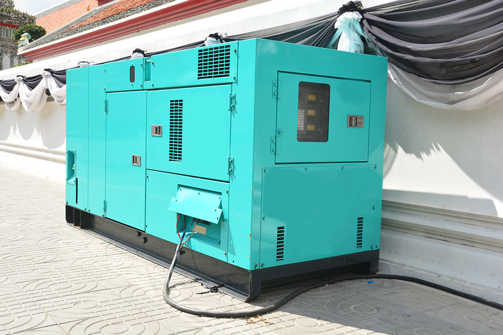 a large blue generator sitting on the side of a building